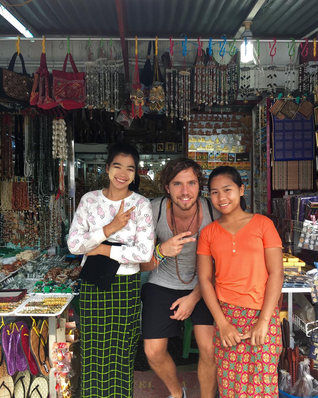 me and two local women in a souvenir shop in Myanmar