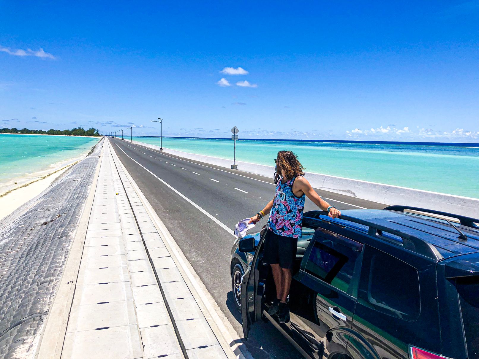 causeway in Tarawa with crystal clear water on both sides of the road