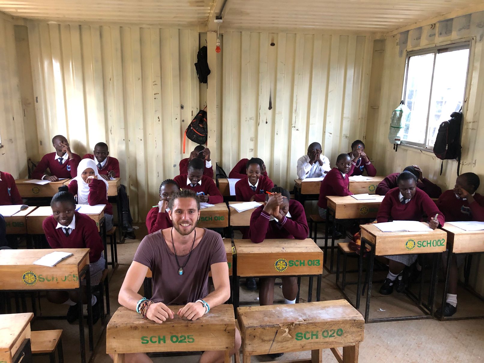 me sitting in a class at a local school with kids at kibera slum