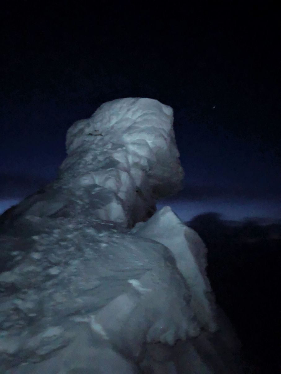 Trollsteinen peak at night