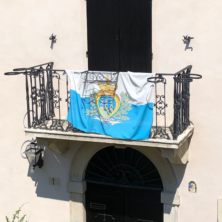 Sammarinese flag outisde a balcony in the Old Town.