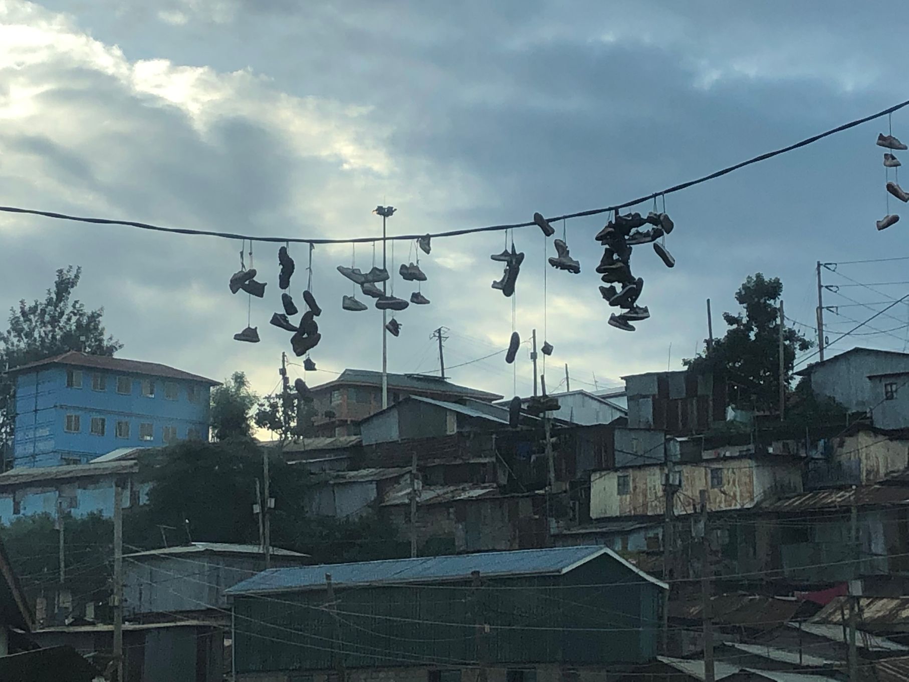 shoes hanging from electrict wires.