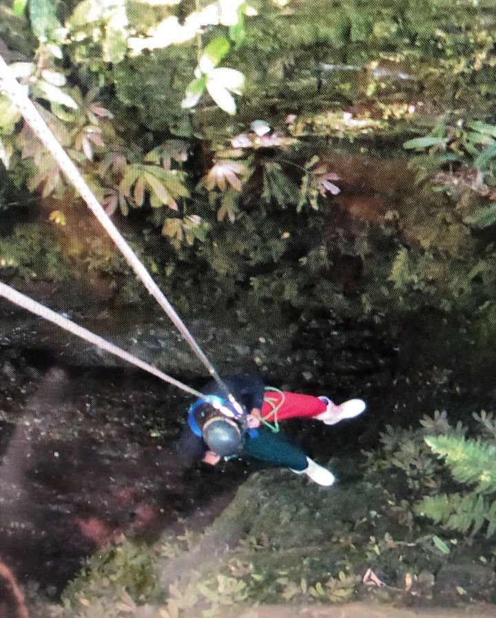 Abseiling 25 mt to reach the entrance of the cave