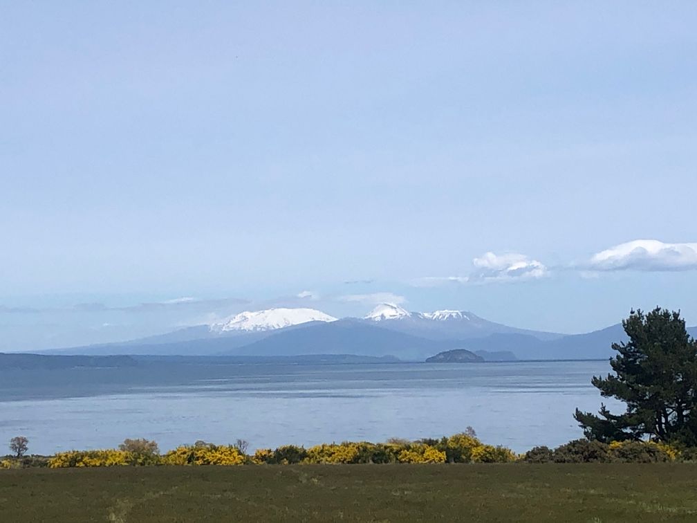 The lake around Taupo is very beautiful and surrounded by mountains.